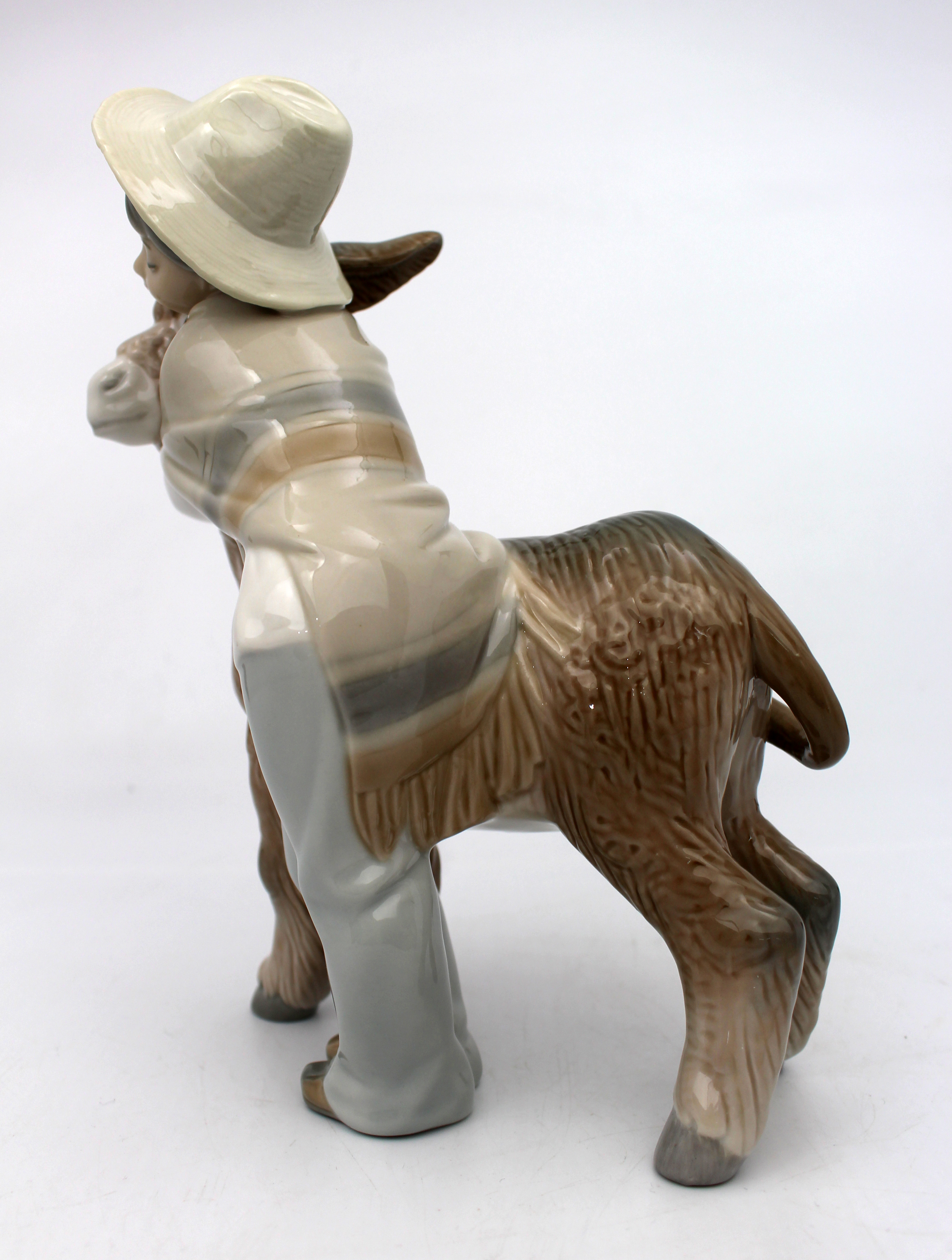 Lladro Boy Hugging Donkey