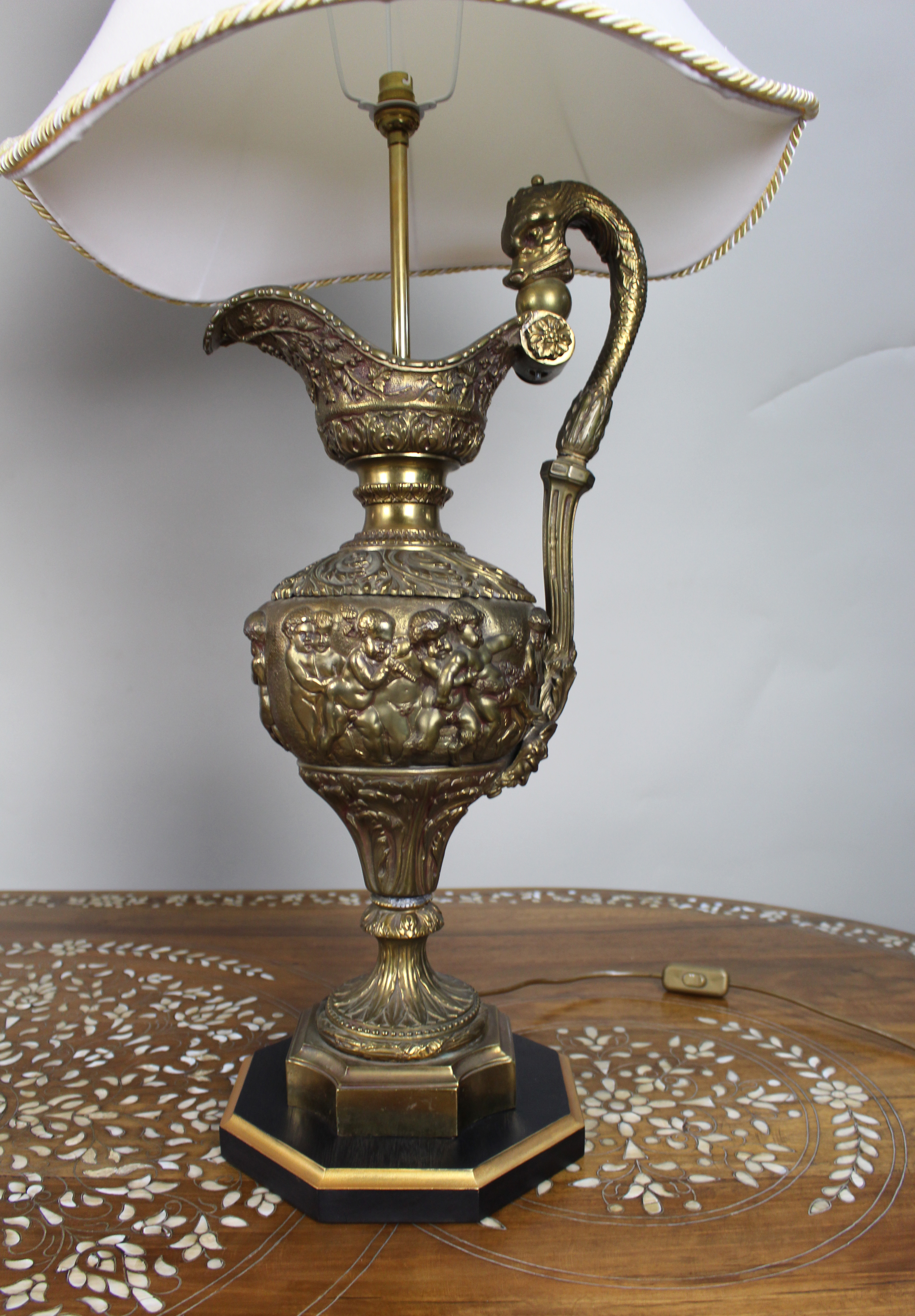 Pair of Early 20th Century French Neoclassical Ewer Lamps with Putti Relief