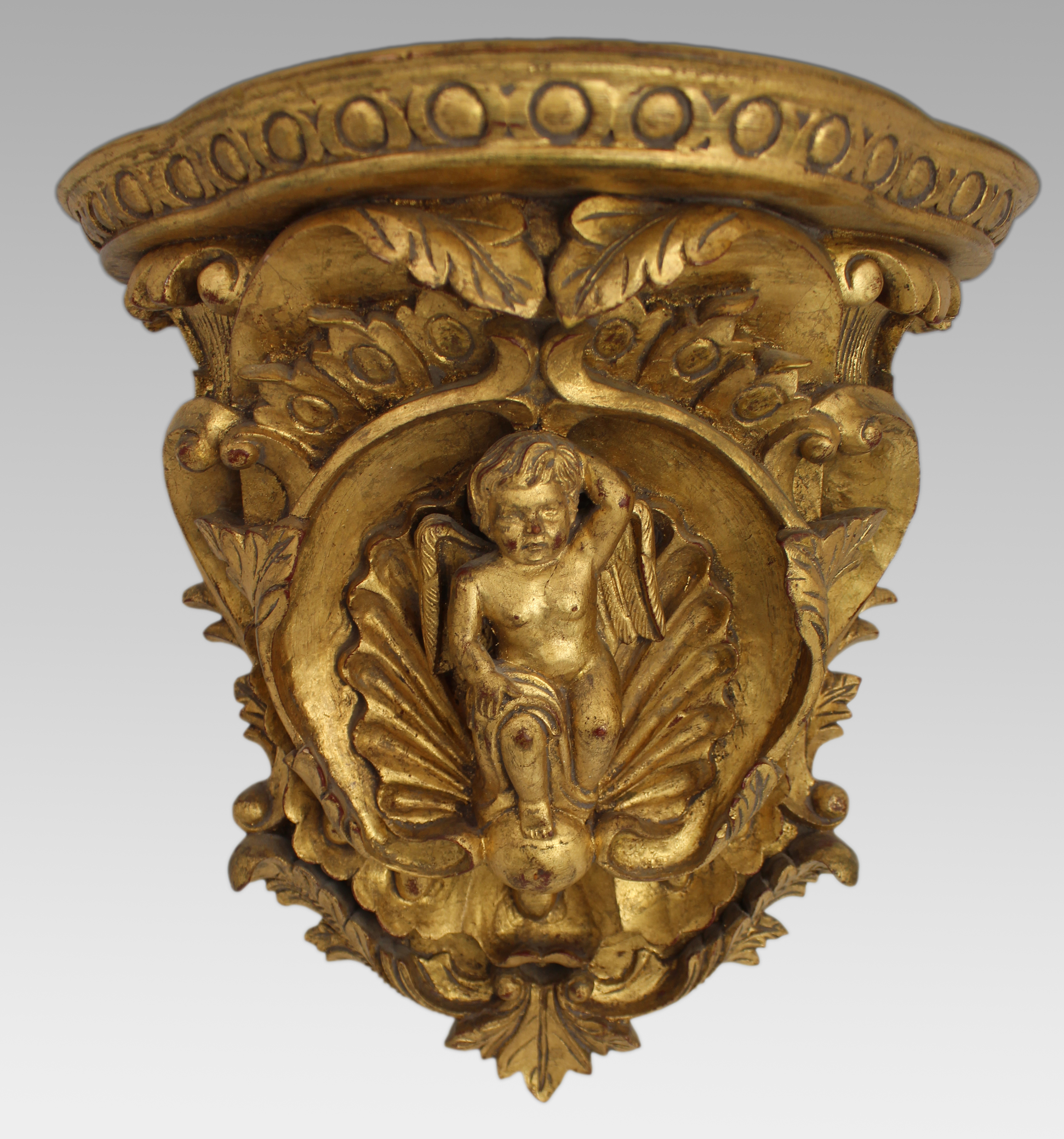 Pair of Carved Giltwood Wall Brackets with Cherub Motifs