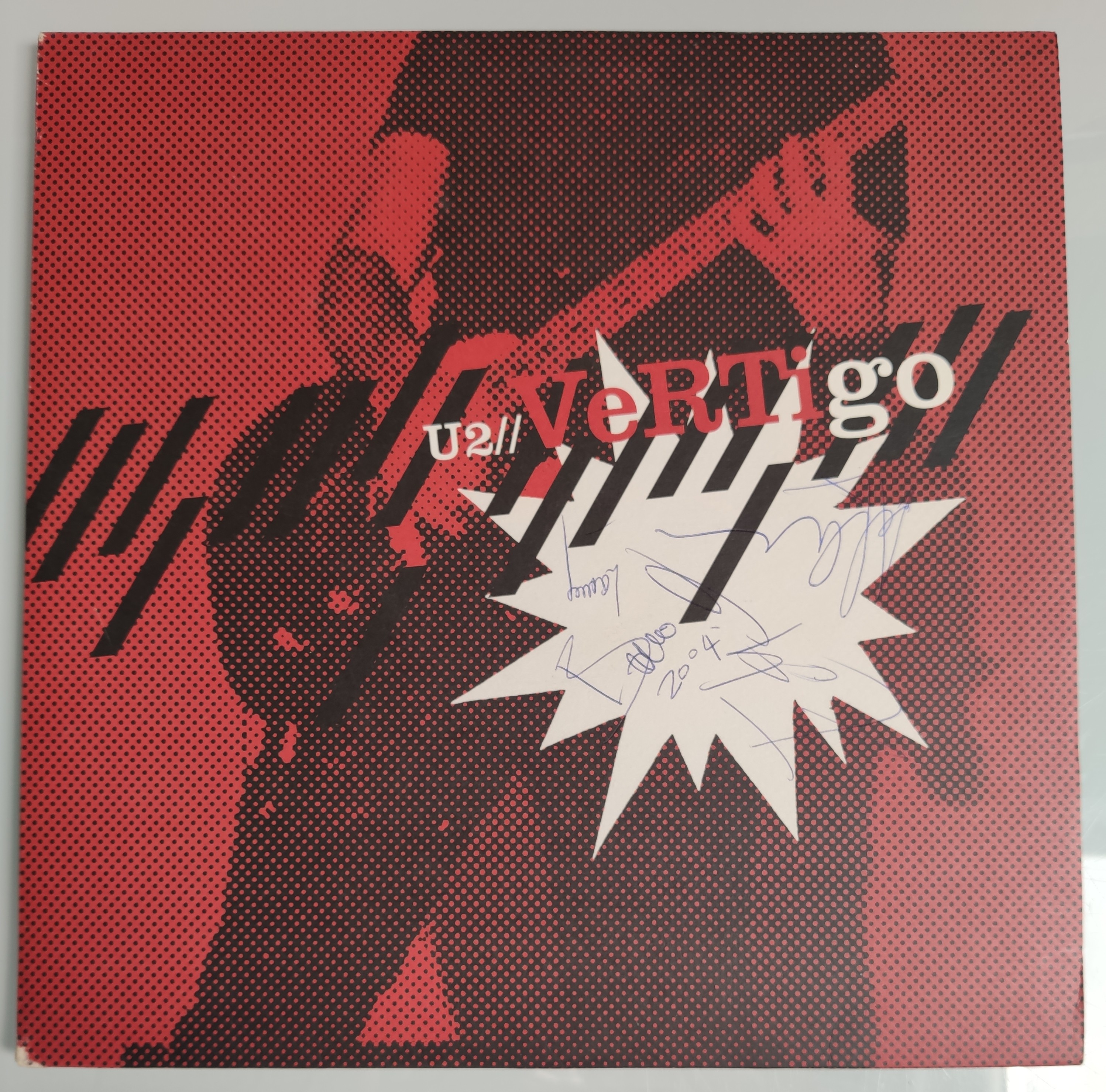 U2 – Vertigo Famed Vinyl Record – Autographed by – Bono, The Edge, Larry Mullen and Adam Clayton.