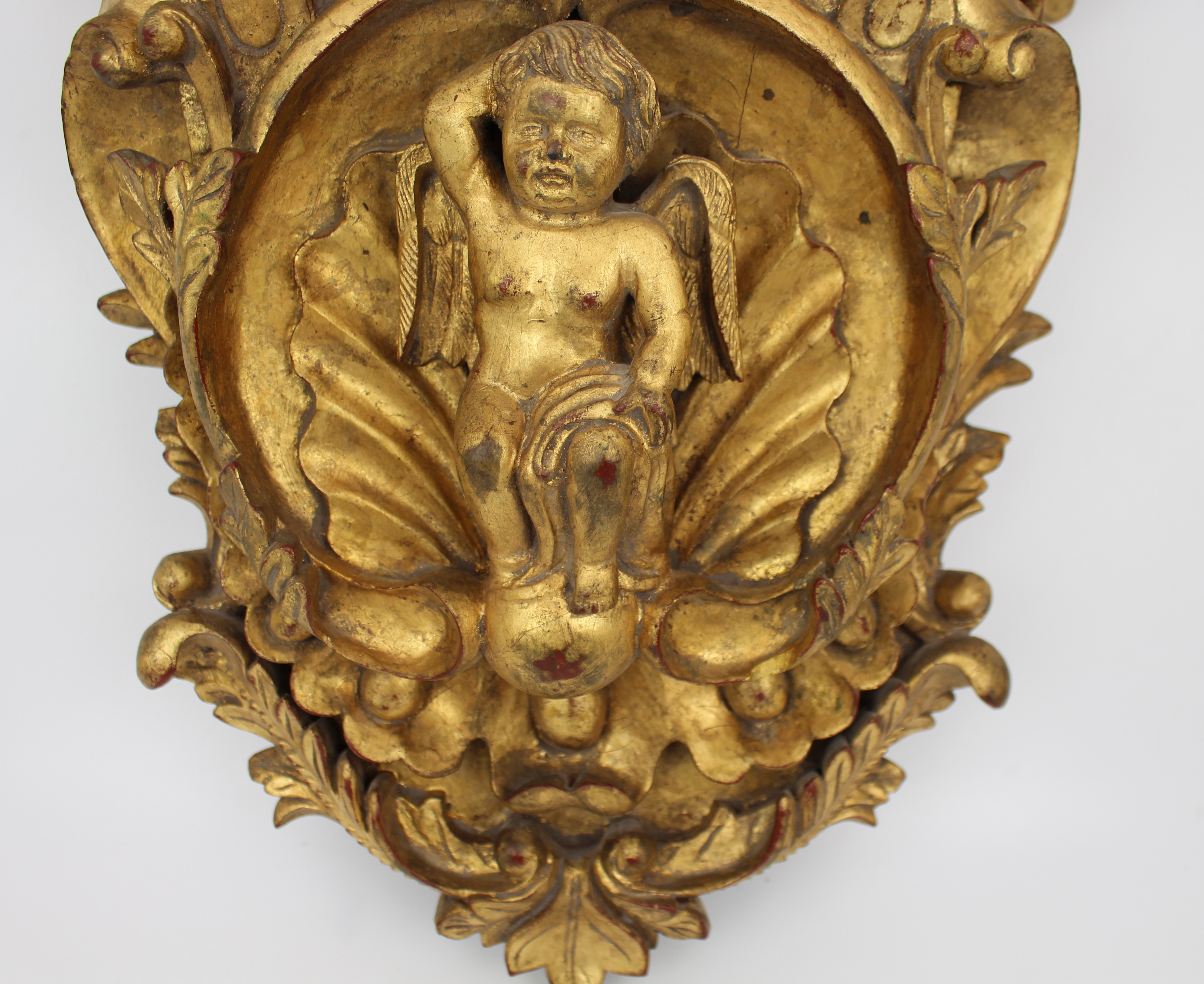 Pair of Carved Giltwood Wall Brackets with Cherub Motifs